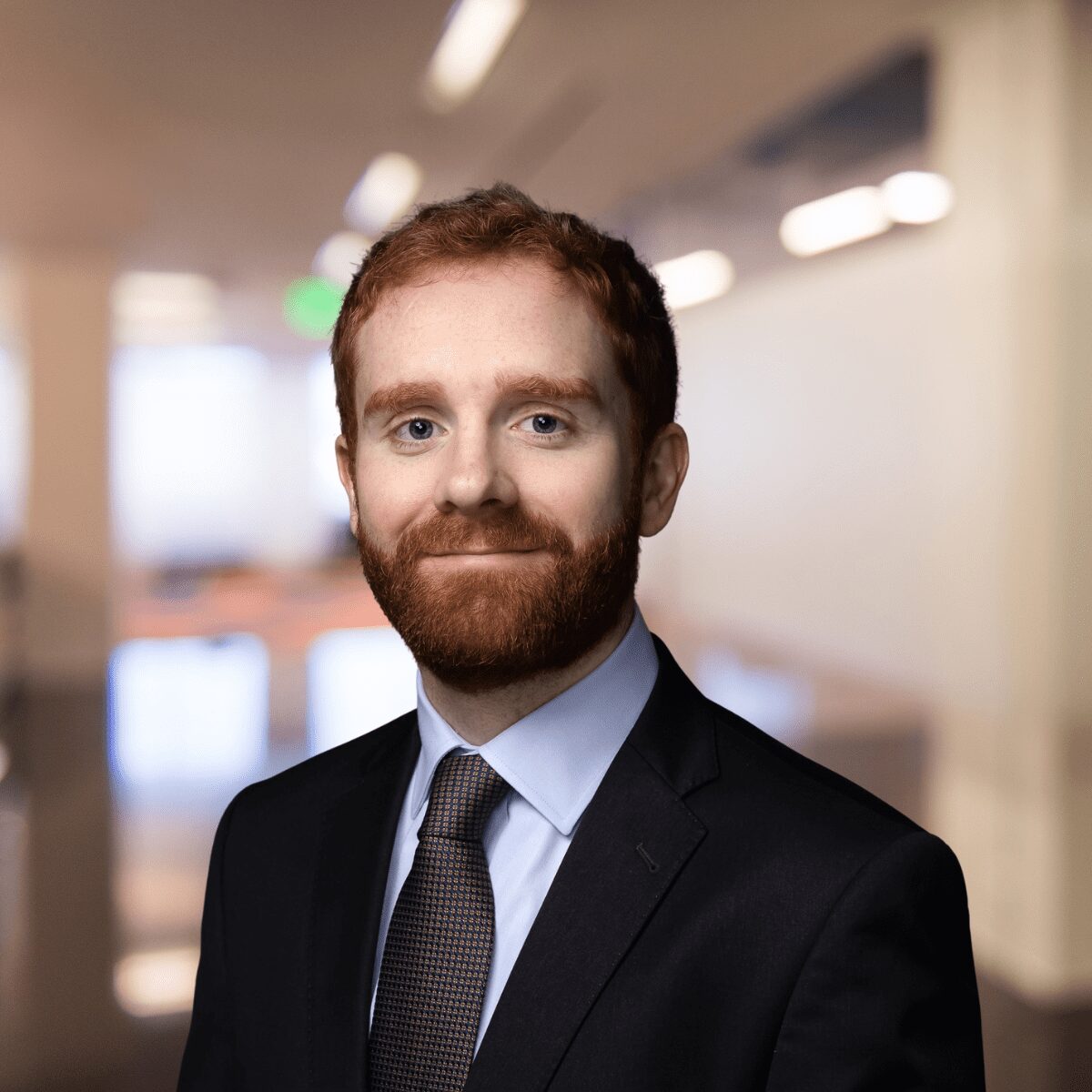 Jack McGardle headshot with blurred background in the background